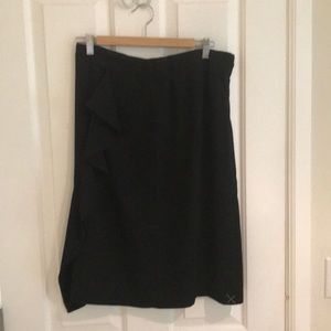 Black J. Crew skirt with side ruffle.